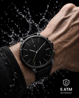 ZE Pro 3 Smartwatch with a black dial and black strap worn on a person's wrist, surrounded by dramatic water droplets and splashes against a black background. A white '5 ATM WATERPROOF' badge appears in the lower right corner. thumbnail